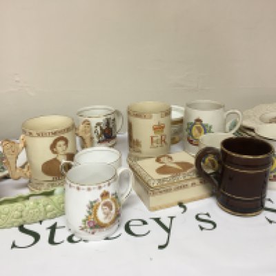 A collection of Royal Commemorative Elizabeth II coronation ceramics and porcelain cups mugs plates and two tin trays. NO RESERVE.