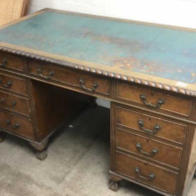 A walnut pedestal desk the rectangular top with a gadroon moulded edge leather top above three drawers each pedestal with a further three drawers on ball and claw feet. 138x77cm. NO RESERVE