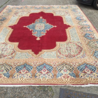 A large Persian carpet, approx 3 metres x 4.96 metres. Shipping category D.