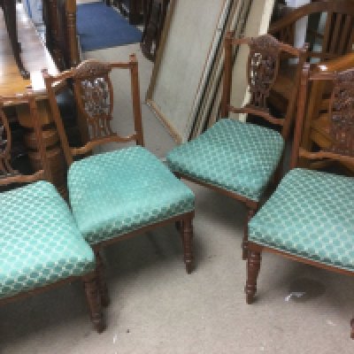A set of four Edwardian chairs with carved backs. Shipping category D. NO RESERVE