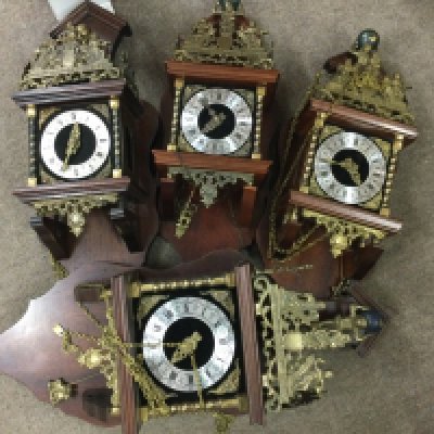 Four ornate wall clocks. The dials having Roman Numerals. NO RESERVE
