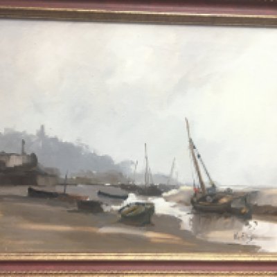 A framed Vic Ellis oil on board depicting boats in harbour. 58x49cm