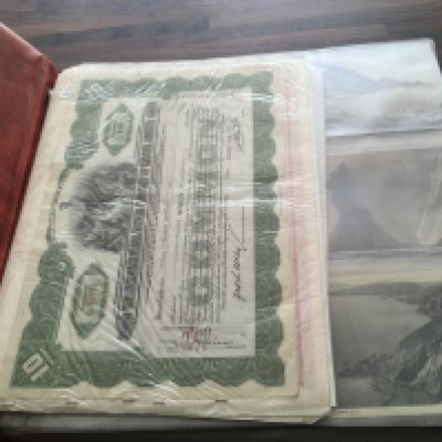 An album of vintage postcards including UK locations, foreign cards, Royal family cards etc. postage category C