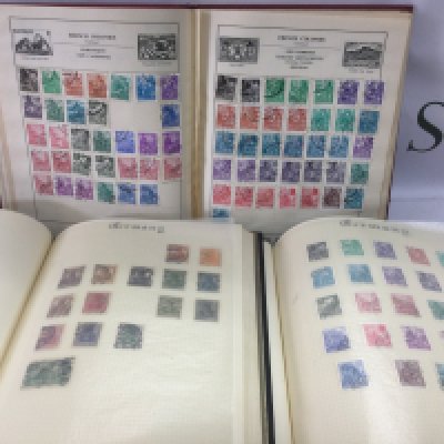 Eleven albums of world stamps. Shipping category D.