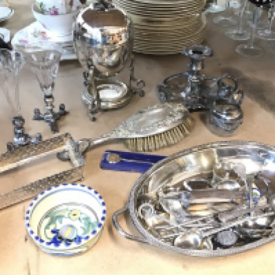 A collection of silver plate including Egyptian style flower vases, Egg Coddler, silver hallmarked hand brush, some silver hallmarked spoons . Postage category C
