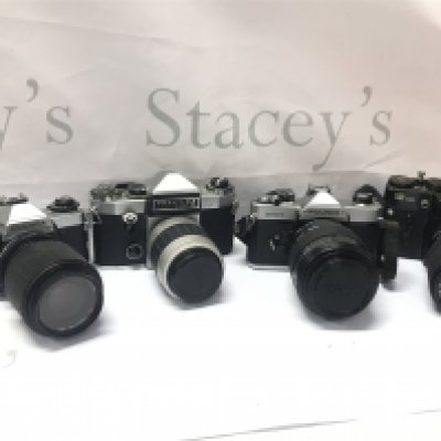 A selection of vintage SLR cameras including Fujica AX1 , Praktica super TL, Zenit 12XP. Postage category C