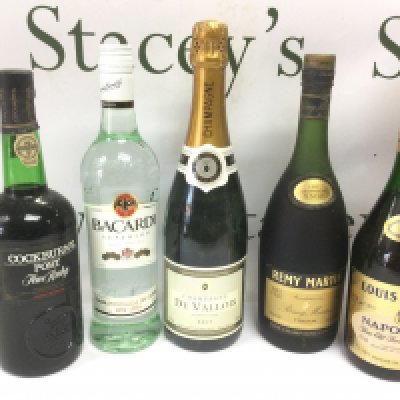 Ten bottles of champagne and spirits. Shipping category D.