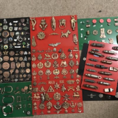 A Collection of various metal detector found items including tokens, cap badges, Saint Christopher pendants etc . Postage category C
