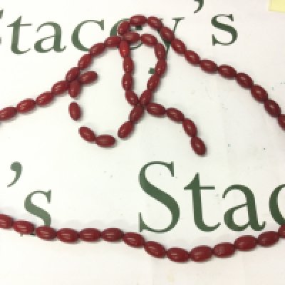 A Bakelite cherry coloured necklace 120cm long 120g , postage category A