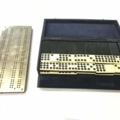 Leather boxed antique brass cribbage board and domino set.