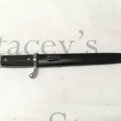 A German dress bayonet and scabbard , 34cm total length , 22cm blade long. This lot cannot be posted