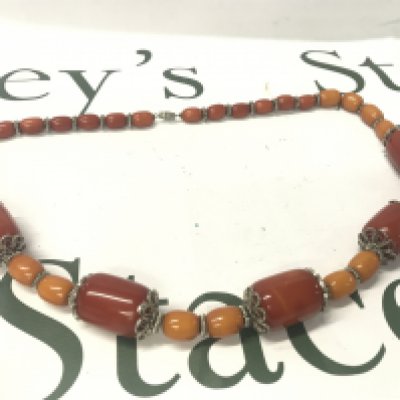 A Bakelite and silver colour necklace, 95g, 64cm long. Postage category A