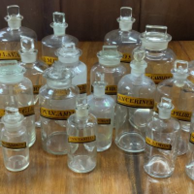 A good collection of 19th Century paper label apothecary jars. (21).