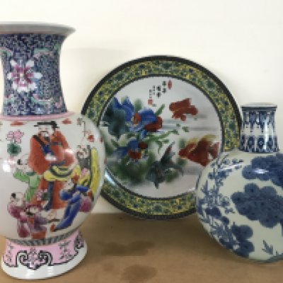 Chinese porcelain including a gold fish platter (34cm wide), a blue and white porcelain vase (25.5cm tall) with floral patterns and a Famille Rose vase (37.5cm tall). This lot cannot be posted