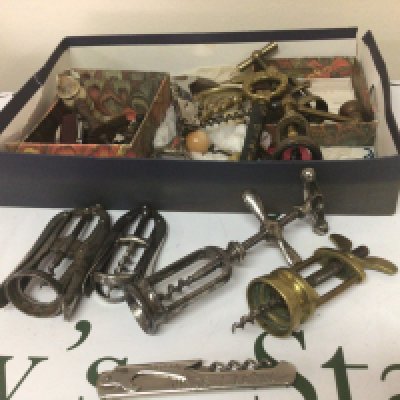 A collection of Vintage corkscrews pocket knifes and other conforming oddments.