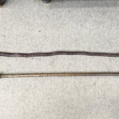 Two carved Maori walking sticks , 84cm long