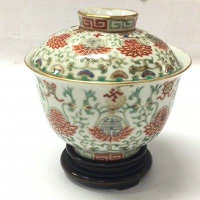 A Chinese porcelain bowl decorated with auspicious characters and motifs, with lid. Red Six character at base. This lot cannot be posted