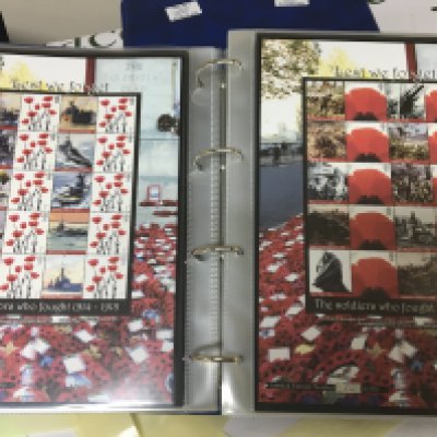 An Album containing limited edition British Royal Mail First class Pictorial stamp sheets Buckingham covers and others each sheet with ten first class stamps. Approximately sixty sheets. All unused mint condition.