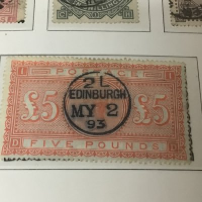 A Great Britain album of Stamps containing a Victorian Five pound Orange with Edinburgh stamp 1893 other high value Victorian stamps several one pound Victorian stamps and many others Edward VII one pound stamp High value unused George V seahorse stamps and a good selection of George VI unused stamps. The album also including a very good selection of Used and unused penny red stamps on eleven sheets. Also 1840 Penny black and other examples.
