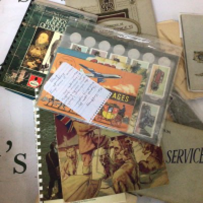 A box containing albums of cigarette and tea cards Film stars trains Blackshaw cat Sport fishing British Marvels Historic cars Shell coin sets and numerous others.