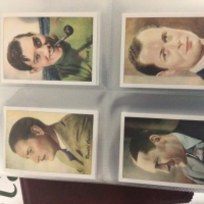 A collection of five well presented albums containing cigarette cards including 1930s film stars large cards players Prescott locomotives some postcards and pop and BBC radio 1 and many other cards.