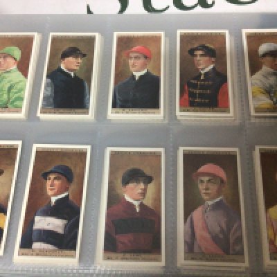 A Collection of five well presented albums containing cigarette cards some post cards vintage cigarette covers. Ogdens Jockeys and Owners Colours and many others.