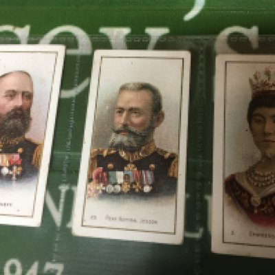 A box containing a large quantity of vintage cigarette cards and other cards and ephemera including some Taddy & Co Cards and numerous others in unopened packs.