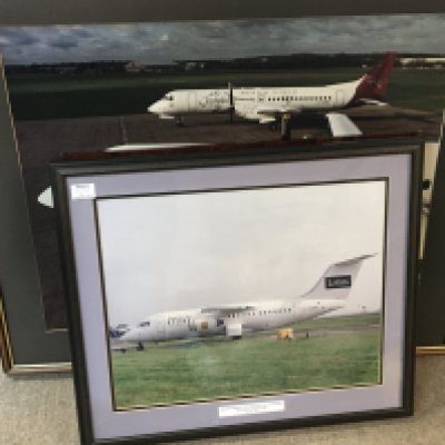 A collection of framed Commercial Aircraft photos and other unframed conforming pictures.