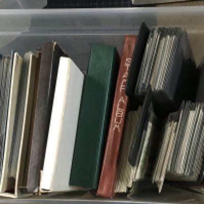 A box containing stamp albums containing mixed world stamps and albums of First day covers