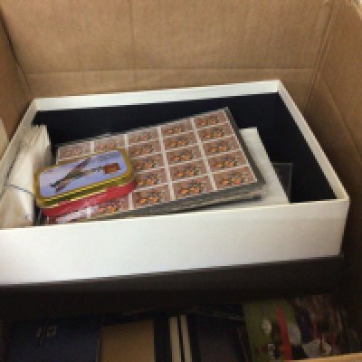 A box containing a quantity of unused Elizabeth II stamp books some pictorial sheets of unused stamps and first day covers and other assorted ephemera.