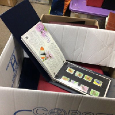 A box containing Isle of Man unused pictorial presentation packs in albums.