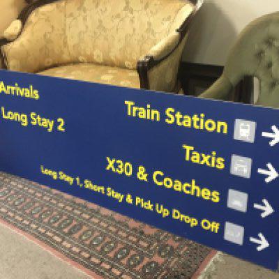 A large Airport information sign white .Perspex type board 182cm x 61cm